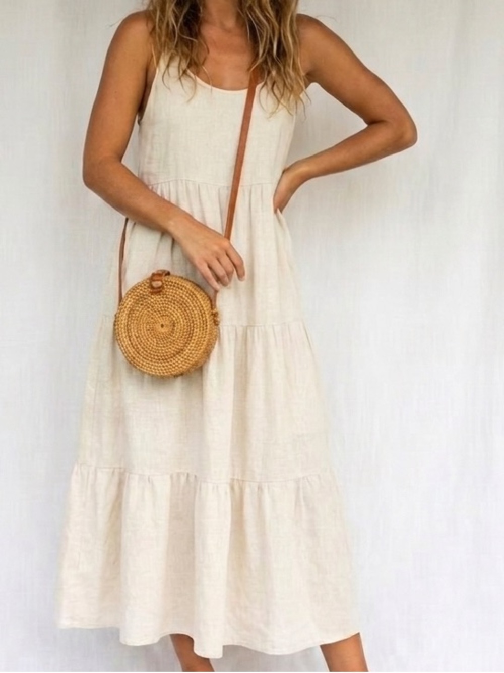 Indonesian made Rattan crossbody round bag. Lined interior snap closure.